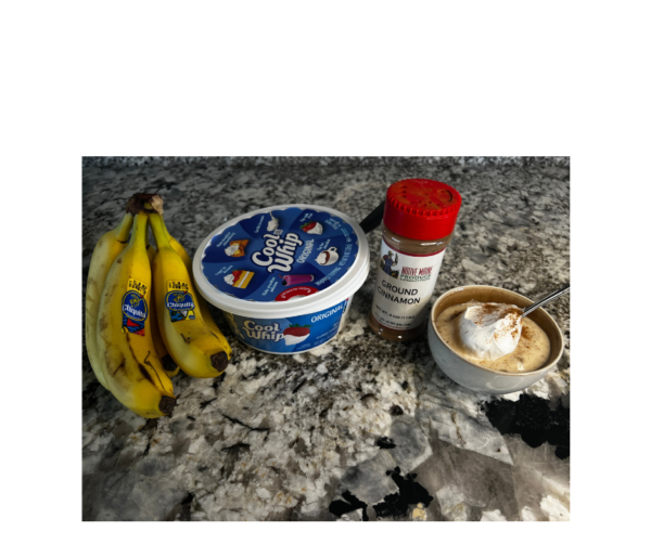 beginner puréed banana blended recipe, cool whip container, spice jar of cinnamon and cup of puréed banana with cool whip and cinnamon on top