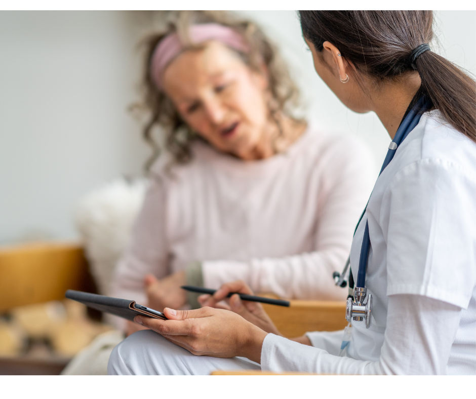 Woman at drs office talking with the dr while looking at a chart together