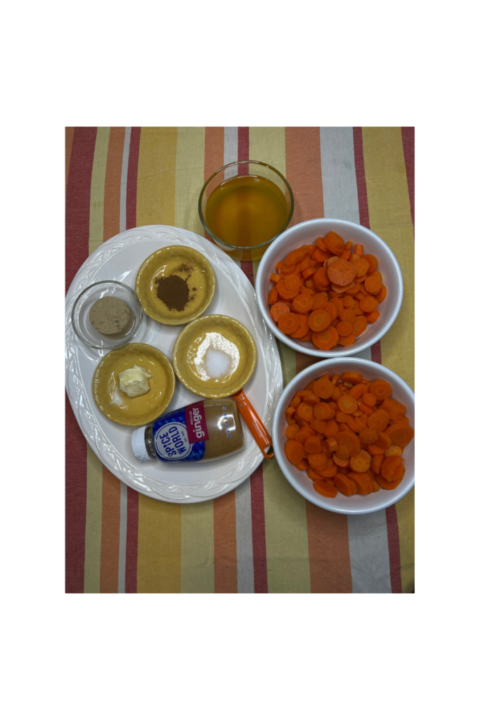 two bowls cooked carrots beside platter of individual small cups spices